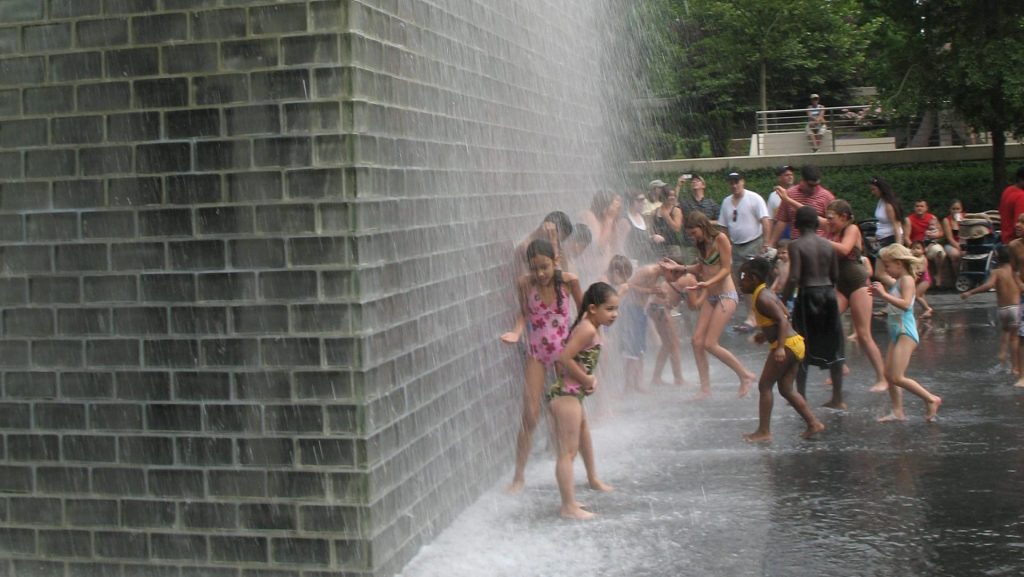 children at outdoor fountain